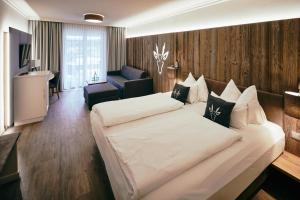 Łóżko lub łóżka w pokoju w obiekcie Hotel Gerl
