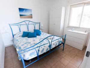 Postel nebo postele na pokoji v ubytování Residenza Jonica