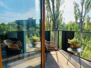 Balkón alebo terasa v ubytovaní Baltic Riviera Apartments - Garden Sanctuary Retreat