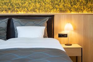 Krevet ili kreveti u jedinici u okviru objekta Hotel Winkelried am See