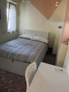 Un pat sau paturi într-o cameră la COCCO HOUSE