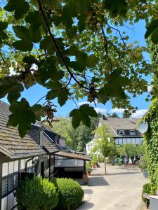 a view of a street in a town with buildings at Hotel Gut Moschenhof in Düsseldorf