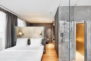 Voodi või voodid majutusasutuse HYPERION Hotel Leipzig toas