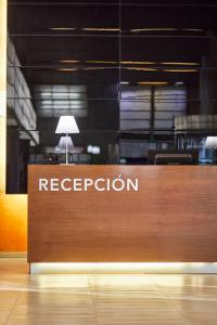 a sign for a reception in an office at Silken Puerta Valencia in Valencia