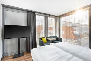 Voodi või voodid majutusasutuse HYPERION Hotel Leipzig toas