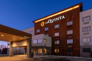 a large building with a clock on the front of it at La Quinta by Wyndham Anchorage Airport in Anchorage