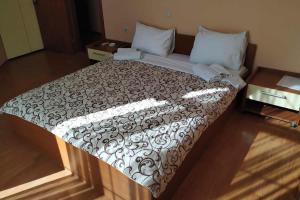 A bed or beds in a room at Restoran Filipovic