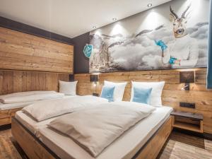 Un pat sau paturi într-o cameră la Chalet Montafon by Interhome
