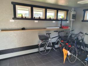 a group of bikes parked in a room at Tiny Haus Dorf Wendland in Gartow