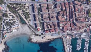 an overhead view of a city with water and buildings at Moraira Beach in Moraira