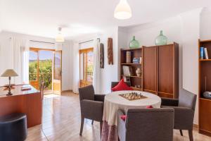 a living room with a table and chairs at Front Line Beach House Up To 6 Guests in Mallorca in Son Serra de Marina