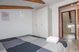 Postel nebo postele na pokoji v ubytování Apartmani Mario