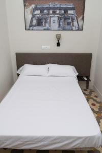 Postel nebo postele na pokoji v ubytování NWT Central Station Valencia