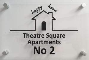 a sign that says happy karma theatre square apartments no at Theatre Square Apartments in Novi Sad