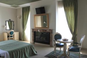 Postel nebo postele na pokoji v ubytování Hotel Capovilla