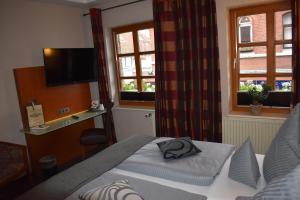 Katil atau katil-katil dalam bilik di Hotel Neue Stuben