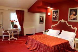 Postel nebo postele na pokoji v ubytování Hotel Capovilla
