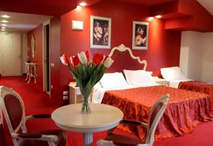 Postel nebo postele na pokoji v ubytování Hotel Capovilla