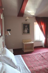 Postel nebo postele na pokoji v ubytování Hotel Capovilla