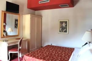 Postel nebo postele na pokoji v ubytování Hotel Capovilla