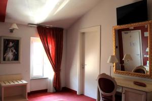 TV a/nebo společenská místnost v ubytování Hotel Capovilla