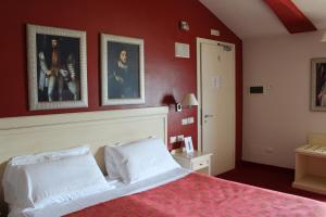 Postel nebo postele na pokoji v ubytování Hotel Capovilla