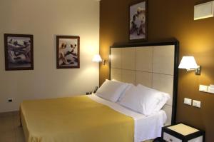 Postel nebo postele na pokoji v ubytování Hotel Capovilla