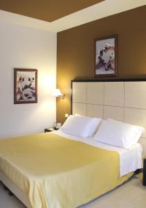 Postel nebo postele na pokoji v ubytování Hotel Capovilla