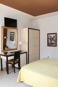 Postel nebo postele na pokoji v ubytování Hotel Capovilla
