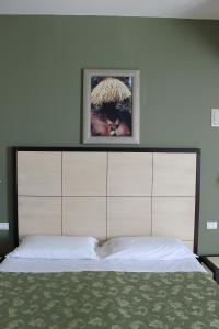 Postel nebo postele na pokoji v ubytování Hotel Capovilla