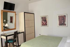 Postel nebo postele na pokoji v ubytování Hotel Capovilla