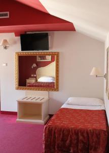 Postel nebo postele na pokoji v ubytování Hotel Capovilla