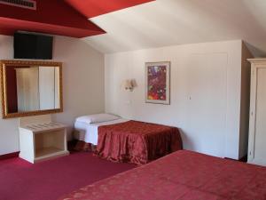 Postel nebo postele na pokoji v ubytování Hotel Capovilla