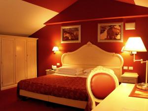 Postel nebo postele na pokoji v ubytování Hotel Capovilla
