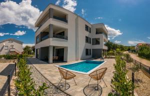 an image of a house with a swimming pool at VILA STEMARK in Njivice