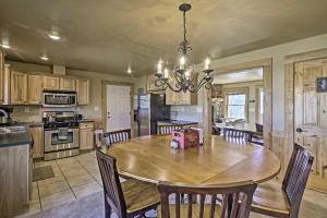 a kitchen and dining room with a table and chairs at Pet-Friendly Cabin Less Than 1Mi to Downtown Fairplay in Fairplay