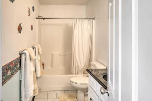 a white bathroom with a toilet and a shower at Peaceful Alaskan Escape 13 Mi to Fairbanks! in Fairbanks +16 photos