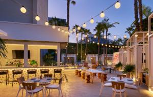 a patio with tables and chairs and lights at Viceroy Santa Monica in Los Angeles +197 photos