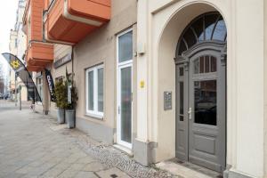 a building with a door on the side of a street at K&S Apartments in Berlin