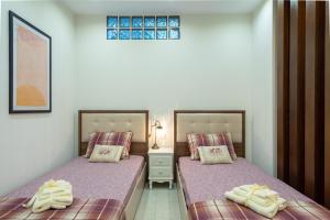 Łóżko lub łóżka w pokoju w obiekcie Meteoron Theasis