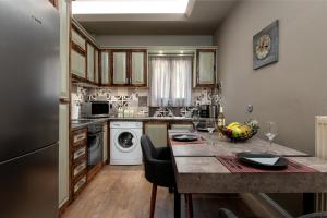 a kitchen with a counter and a dishwasher at Aria apartment in the heart of Corfu city in Ágios Rókkos
