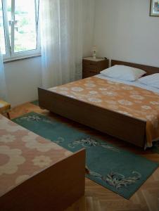 Postel nebo postele na pokoji v ubytování Guest House Mireja