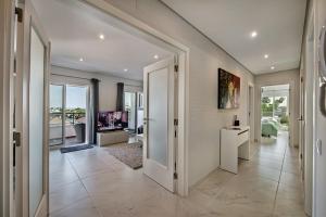 a hallway of a home with a living room at Apartamento Markus in Tavira