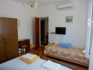 Postel nebo postele na pokoji v ubytování Guest House Mireja