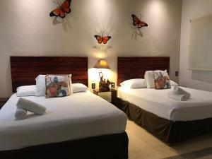 Postel nebo postele na pokoji v ubytování Villas Palmar Holbox