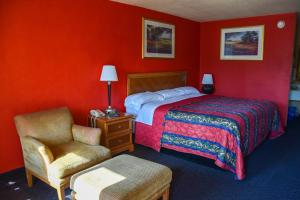 מיטה או מיטות בחדר ב-Homeplace Inn
