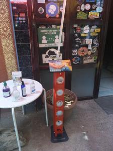 a table and a table and a table and a machine at Hotel France Ouzoud in Ouzoud