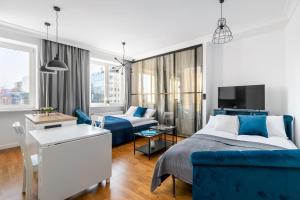 Posteľ alebo postele v izbe v ubytovaní Nowiniarska 8 by Noclegi Renters