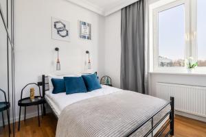 Posteľ alebo postele v izbe v ubytovaní Nowiniarska 8 by Noclegi Renters
