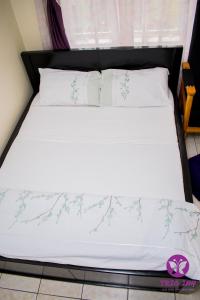Ein Bett oder Betten in einem Zimmer der Unterkunft The Trio Inn